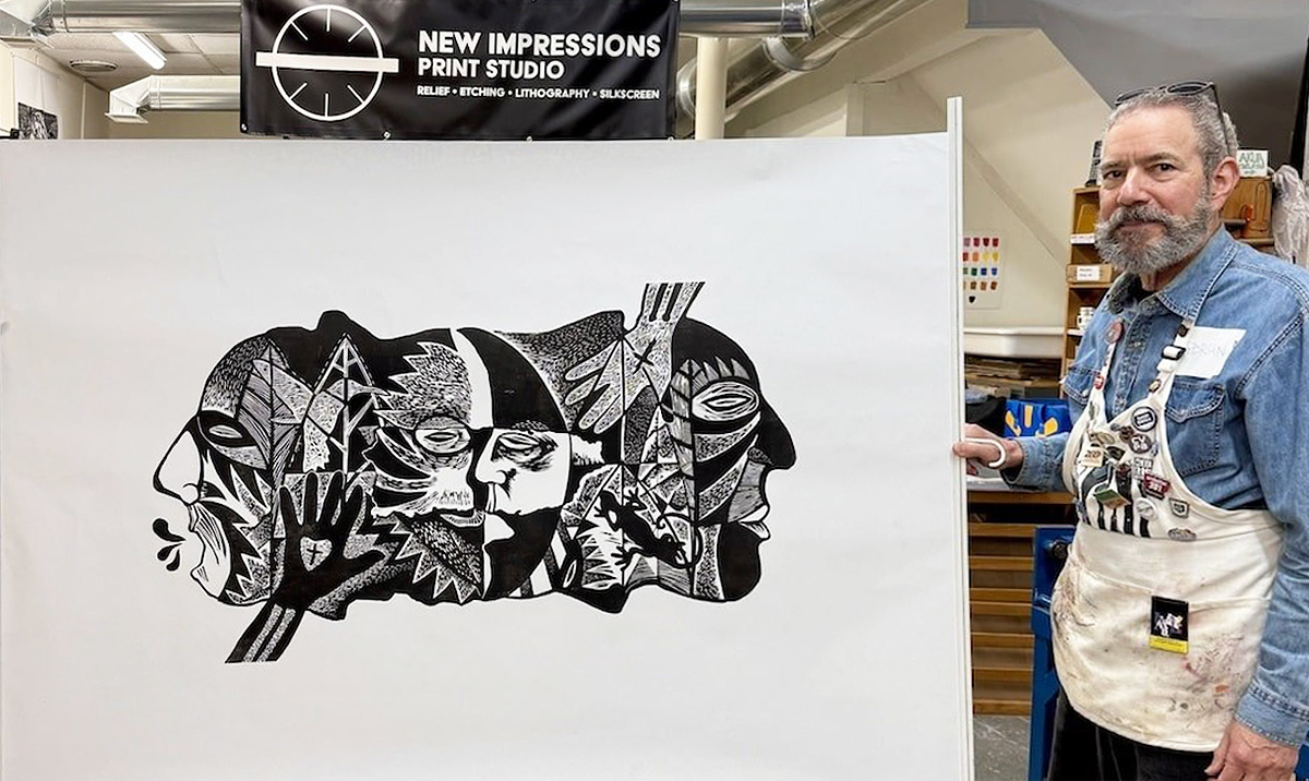 Adrian R Tio holding a final print